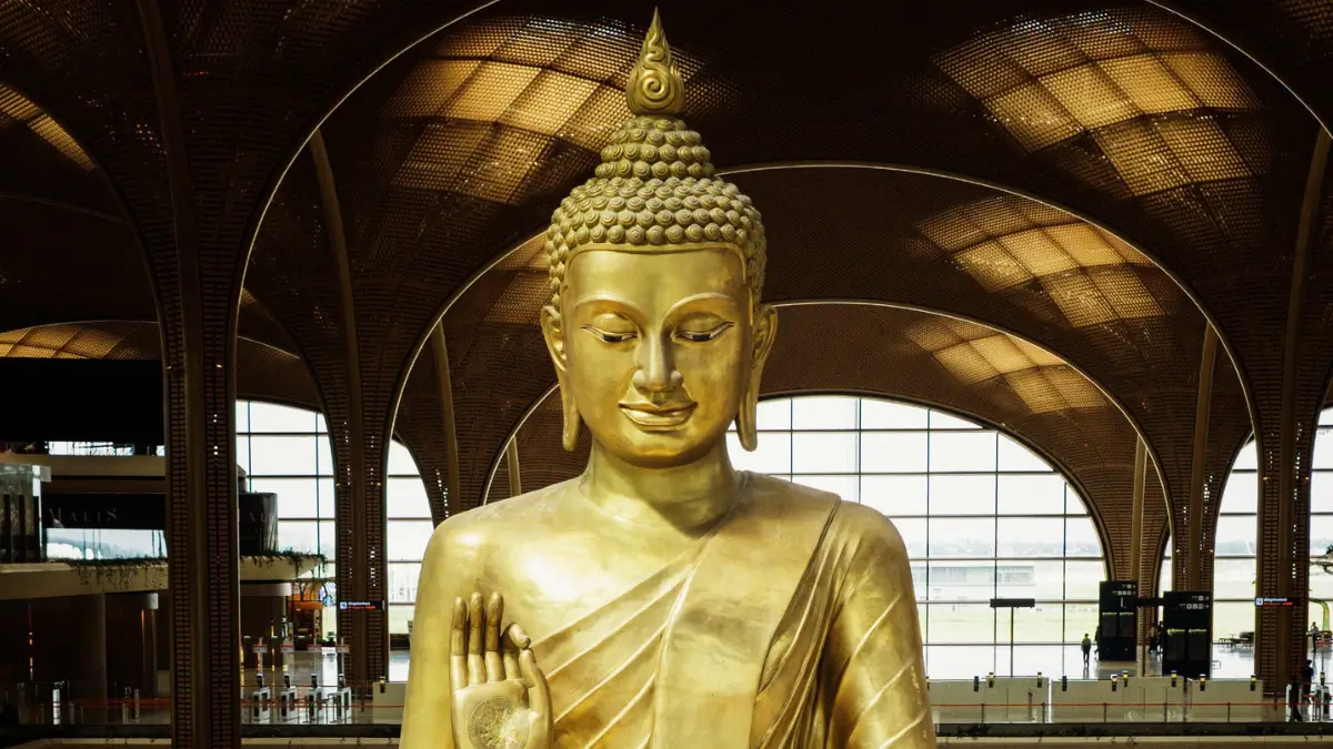 Large Golden Buddha statue in KTI arrivals hall